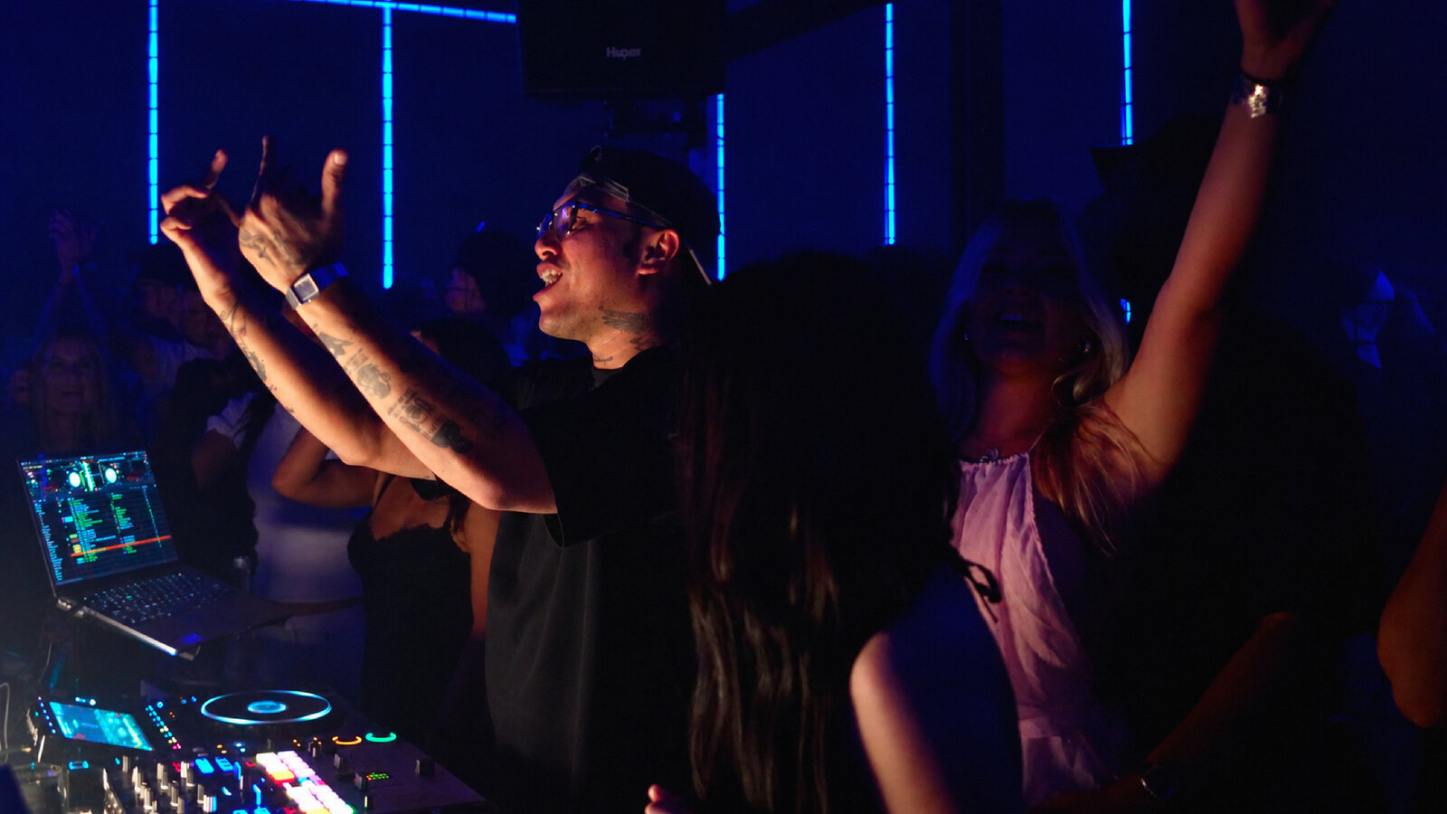 DJ set at the decks, blue club lighting