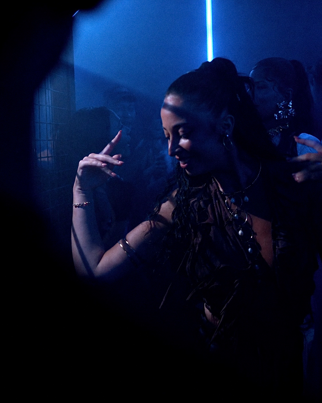 Woman dancing, blue light