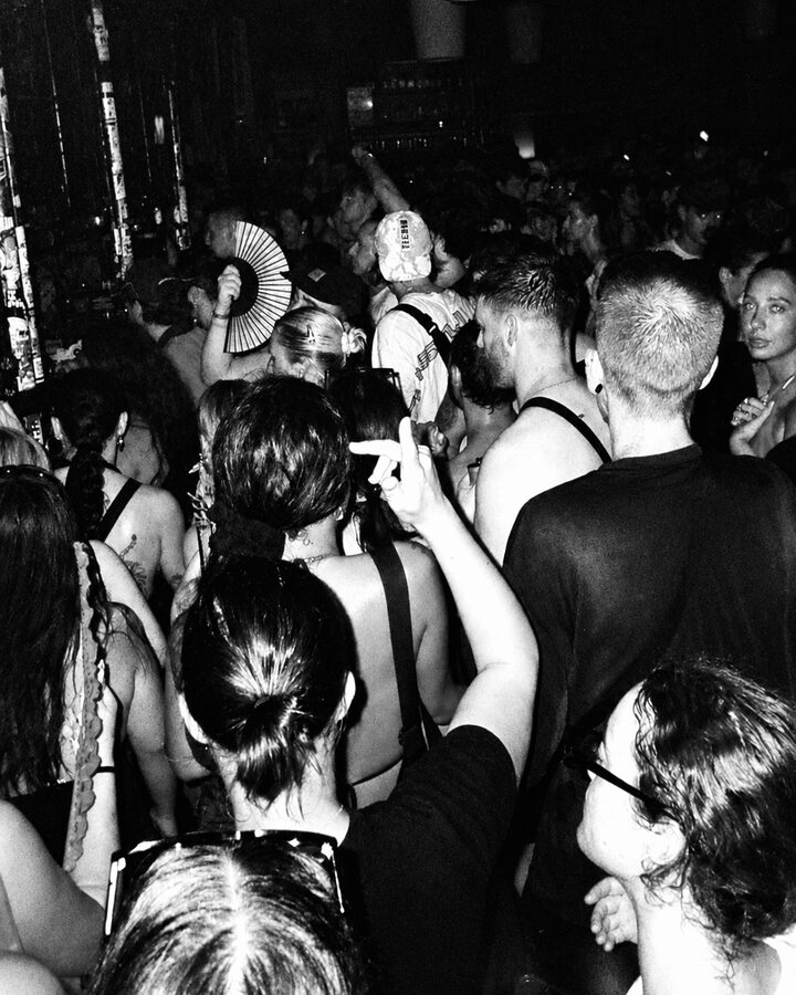 Crowd with hand fan, b&w
