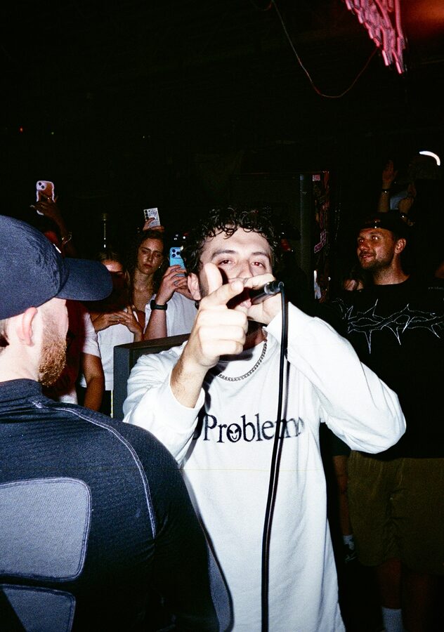 MC pointing to camera on film