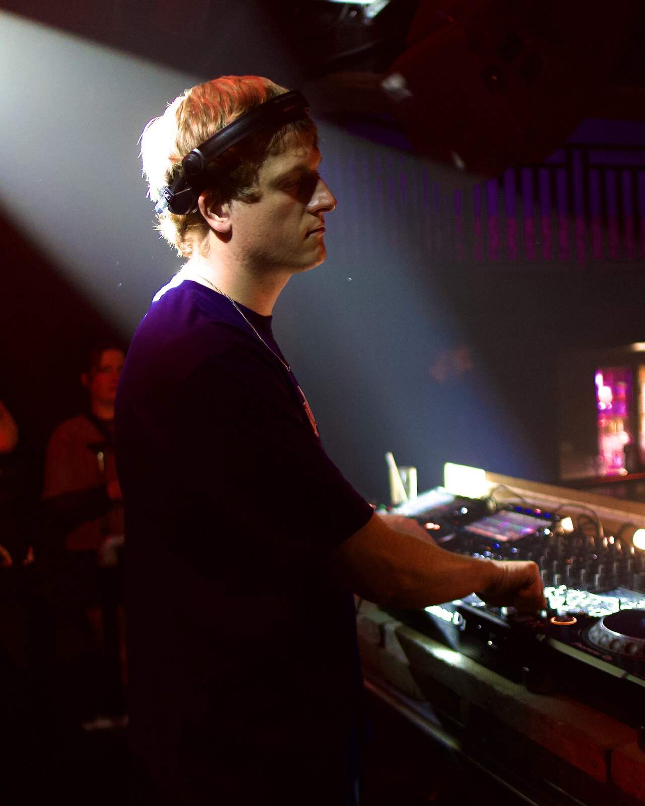 DJ profile portrait, purple lighting
